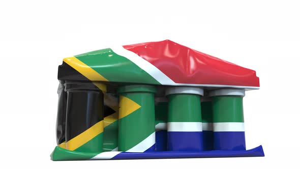Deflating Bank or Government Building with Printed Flag of South Africa alt