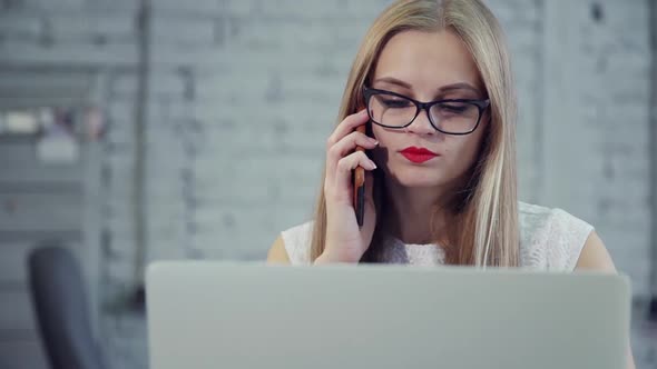 Attractive Woman with Red Lips Is Sitting and Working in New Finance Project at Office Table.