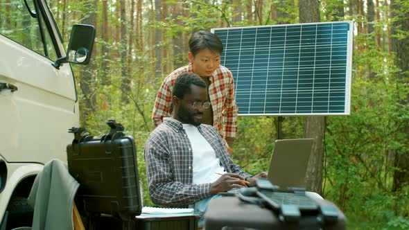 Scientists Looking At Laptop Screen