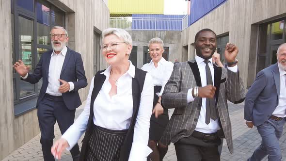 Portrait of Group of Multiracial Business People Performing Crazy Dance Moves