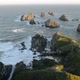 The Setting Sun Illuminates Boulders and Waves of Nugget Point - VideoHive Item for Sale