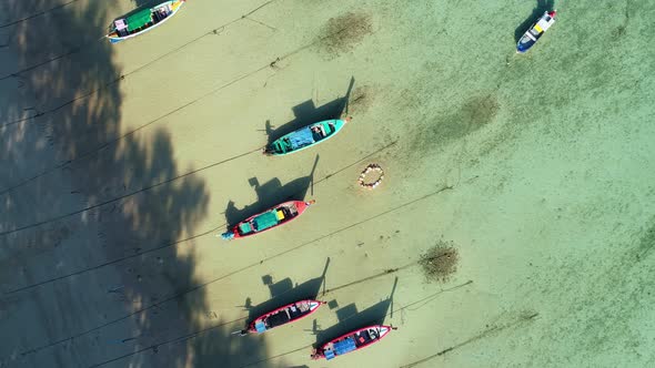 Amazing aerial Top view Longtail fishing boats in the tropical sea