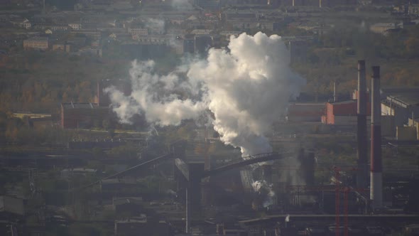 Air pollution over the city by emissions from industrial chimneys