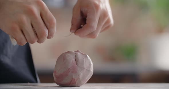 Ceramist Kneads a Colored Piece of Clay to Make a Narikomi Pottery at the Workshop Potter at Work