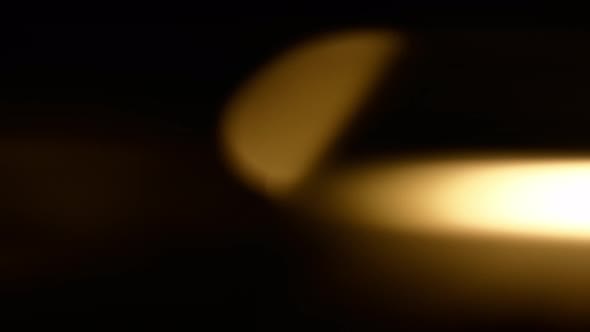 Defocus Circles of Bokeh Lights Moving and Blinking in Night Darkness