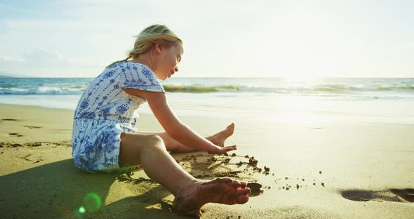 Young Girl Playing on the Beach