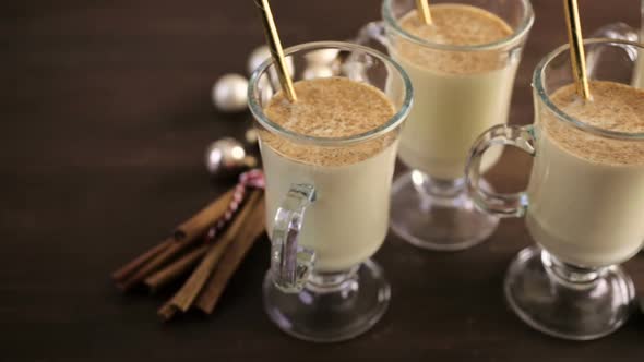 Traditional holiday drink egg nog garnished with nutmeg.