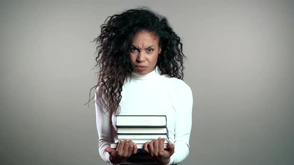 African American Student Woman Is Dissatisfied with Amount of Homework and Books