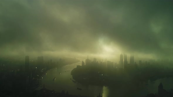 Aerial view of Shanghai downtown at sunset with fog, China. alt