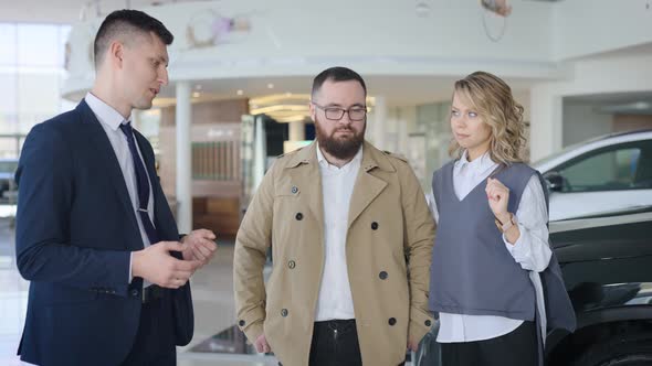 Sales Manager in a Car Dealership Serves a Married Couple