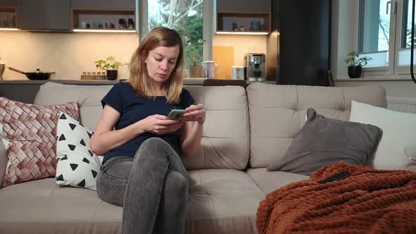 Woman Using Smartphone for Surfing News