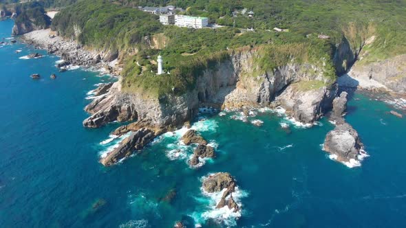 lighthouse on a beautiful natural coastline with turquoise water