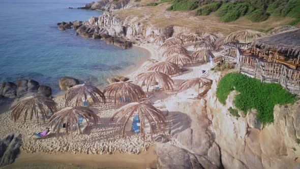 Man on Rocky Beach Aerial Shot