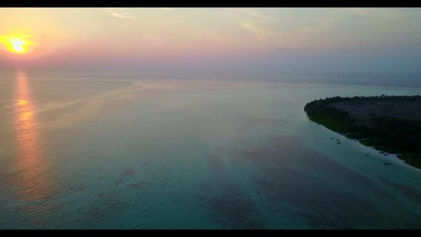 Aerial top down sky of idyllic coastline beach voyage by blue ocean with clean sand background of a 