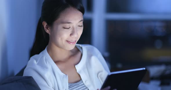 Woman use of tablet computer at home