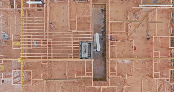 Aerial View of Masonry Brick Builders are Building Walls in Elevator Shaft on Under Construction