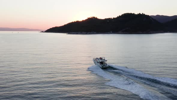 Fast moving motor yacht at the sea.