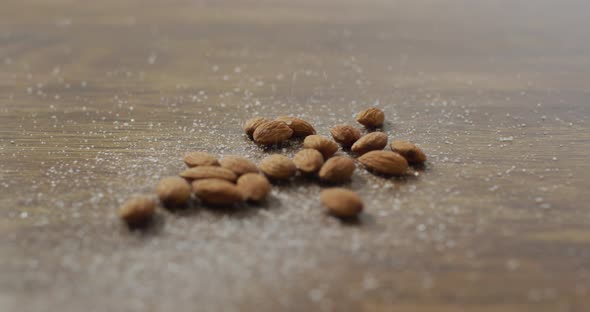 Video of almonds on wooden background