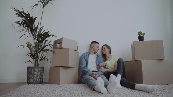 Young Couple Moving at a New Home