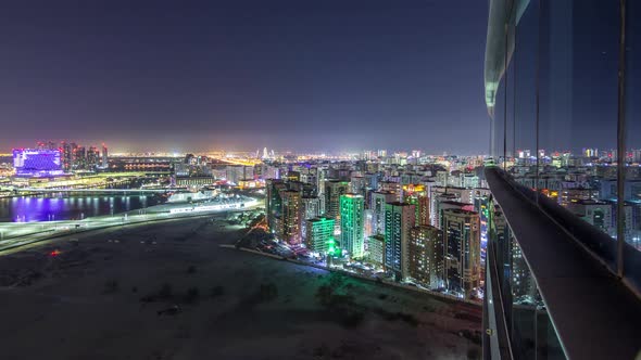 Aerial Skyline of Abu Dhabi City Centre From Above Night Timelapse
