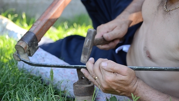 A Man Repairs the Scythe 01