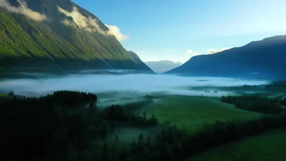 Morning Mist Over the Valley Among the Mountains in the Sunlight