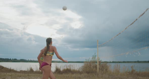 Active Entertainment of Young Sportswomen at Summer Vacation, Ladies Are Playing Beach Volleyball