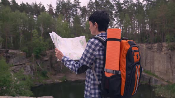 Climber in Canyon with Backpack.