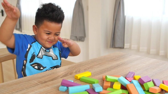 Happy Cute Boy with Color Wood Block Tower Game alt