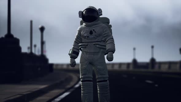 Astronaut Walks in the Middle of a Road alt
