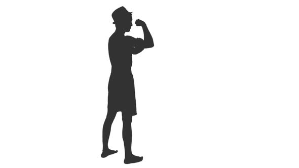 Silhouette of Young Man Posing and Shows Muscles