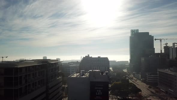 Aerial drone 180-degree pan shot of central Cape Town, Green Point, South Africa. Sunny day with Tab