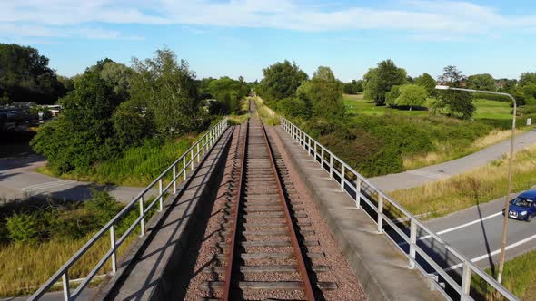 Drone flying over railroad bridge in summer part2