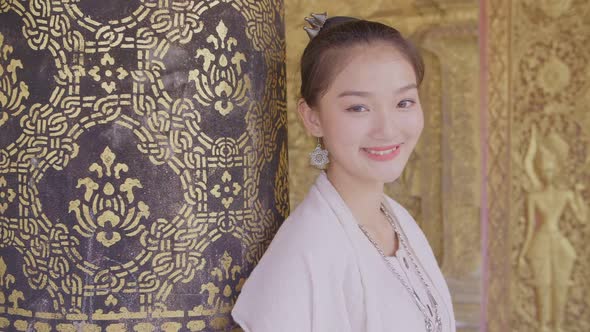 Girl In Lao Traditional Costume Smiling In Temple