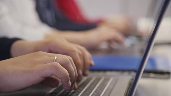 Hands of Successful and Skilled Businessperson on Laptop Keyboar