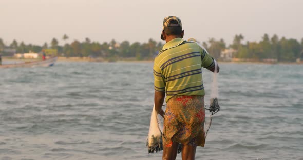 Fisherman With Fishnet Indian Ocean Sunset Closeup Of Sea Waves Slow Motion