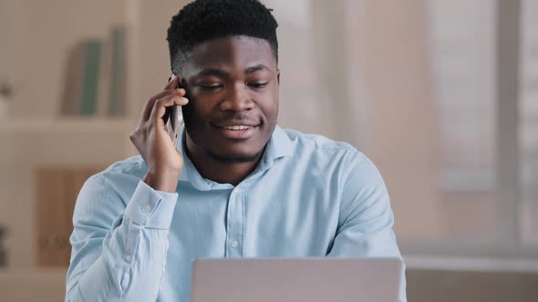 Smiling African Man Male Businessman Employee Freelancer Multitasking Worker Sit at Home Office Talk