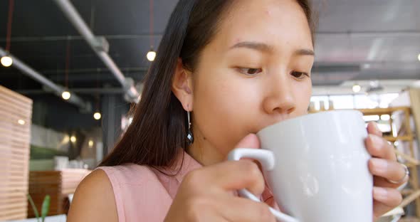 Teenage girl drinking coffee 4k