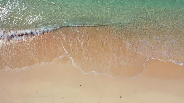 Daytime Flying Abstract View of A Summer White Paradise Sand Beach and Turquoise Sea Background