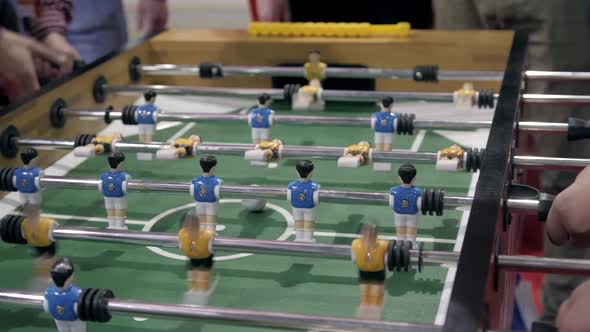 Handsome Cheerful Men Having Fun on Event Playing Table Soccer Close Up Sport Competition Contest