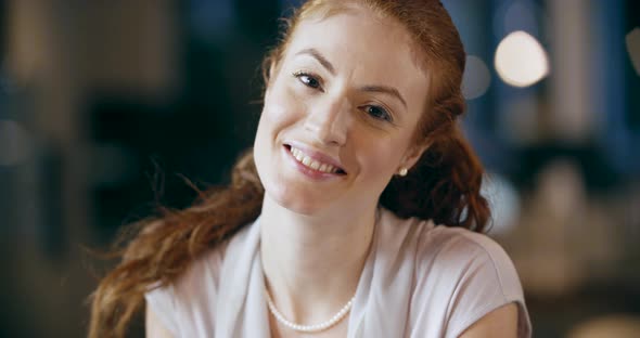 Redhead Woman Writing on Notepad Portrait