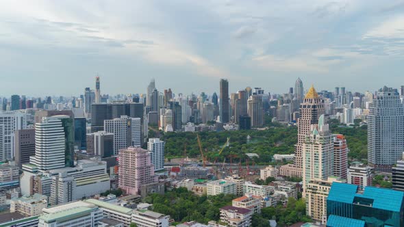 Time lapse of aerial view of green trees in Lumpini Park, Sathorn district, Bangkok Downtown