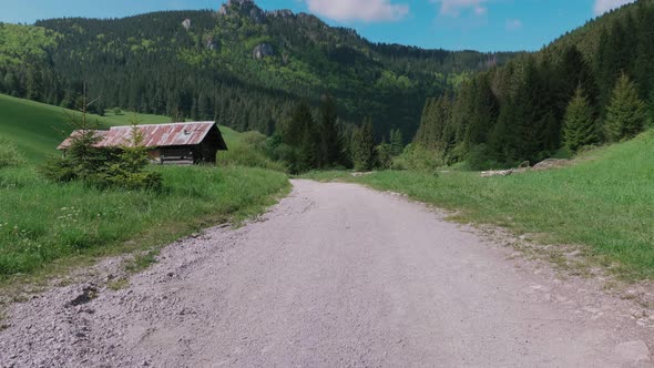 View of a rural hut surrounded by mountains of Velka Fatra National Park in Slovakia