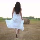 Beautiful Pregnant Woman Running in Wheat Field with Haystacks at Summer Day - VideoHive Item for Sale