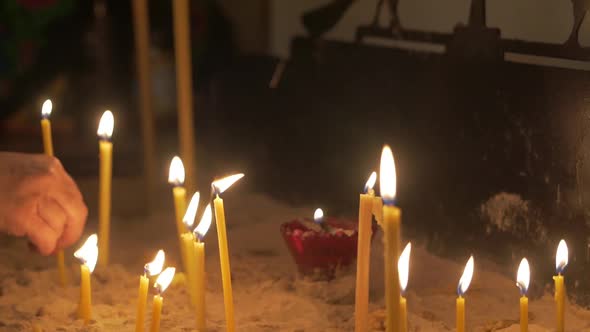 Woman With Candle In Temple