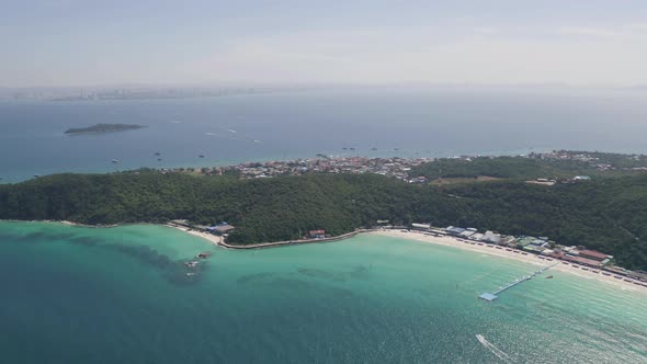 Aerial view of Koh Larn beach, Pattaya with blue turquoise seawater, mountain hills