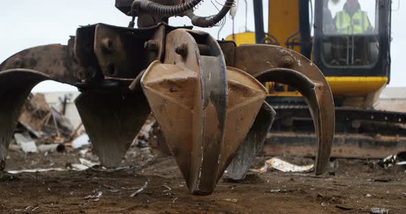 Male worker operating excavator machine