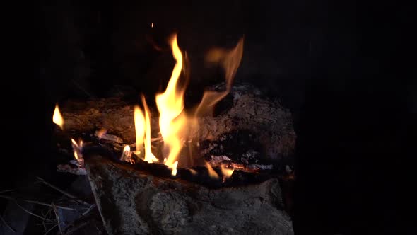 Fire Burning in Fireplace panning left to right in slow motion