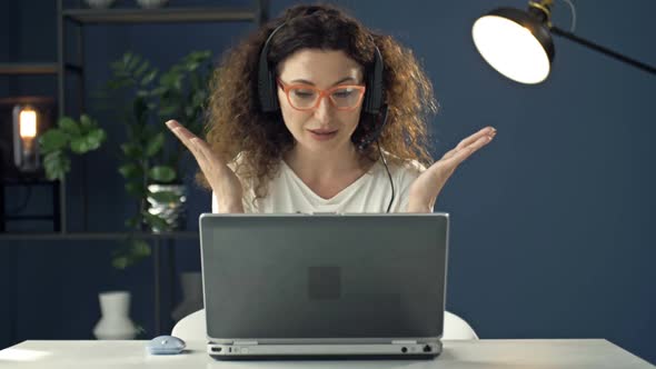 Portrait of a Beautiful Middleaged Woman Working at the Laptop