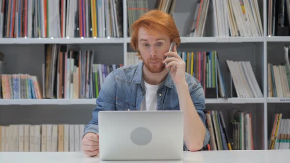 Phone Talk, Redhead Man Attending Call at Work